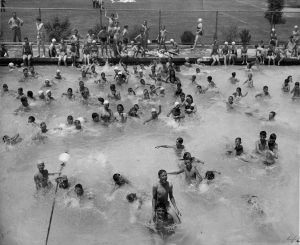 The original pool is still being enjoyed here around 1960. The pool and bathhouse were upgraded in 1978-79. Photo ERVHS, CA 1960.