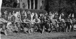 Pictured is a tug-o-war during the 1932 Harvest Home Festival. John Swisher, donor of the photo, is fifth from the left tugging with the rest. Behind the students can be seen the unaltered façade of the Auditorium. Second from left in the back row is Maxine (Mitchell) Tichenor; next to her is John’s sister, Dorothy E. Swisher, in the mask. In the front row, third from the left is Ricki De Kramer. Second from the right is Lucy Spurgeon. -ERVHS-John Swisher