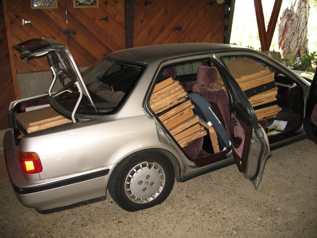Opportunity calls. Eric Warren received a phone call from a man who wanted to get some old Eagle Rock newspapers out of his storage. He and Charles Fisher followed up and found the bound volumes of the Northeast Newspapers. Here they are in the back of my Honda. (Eric Warren-ERVHS)